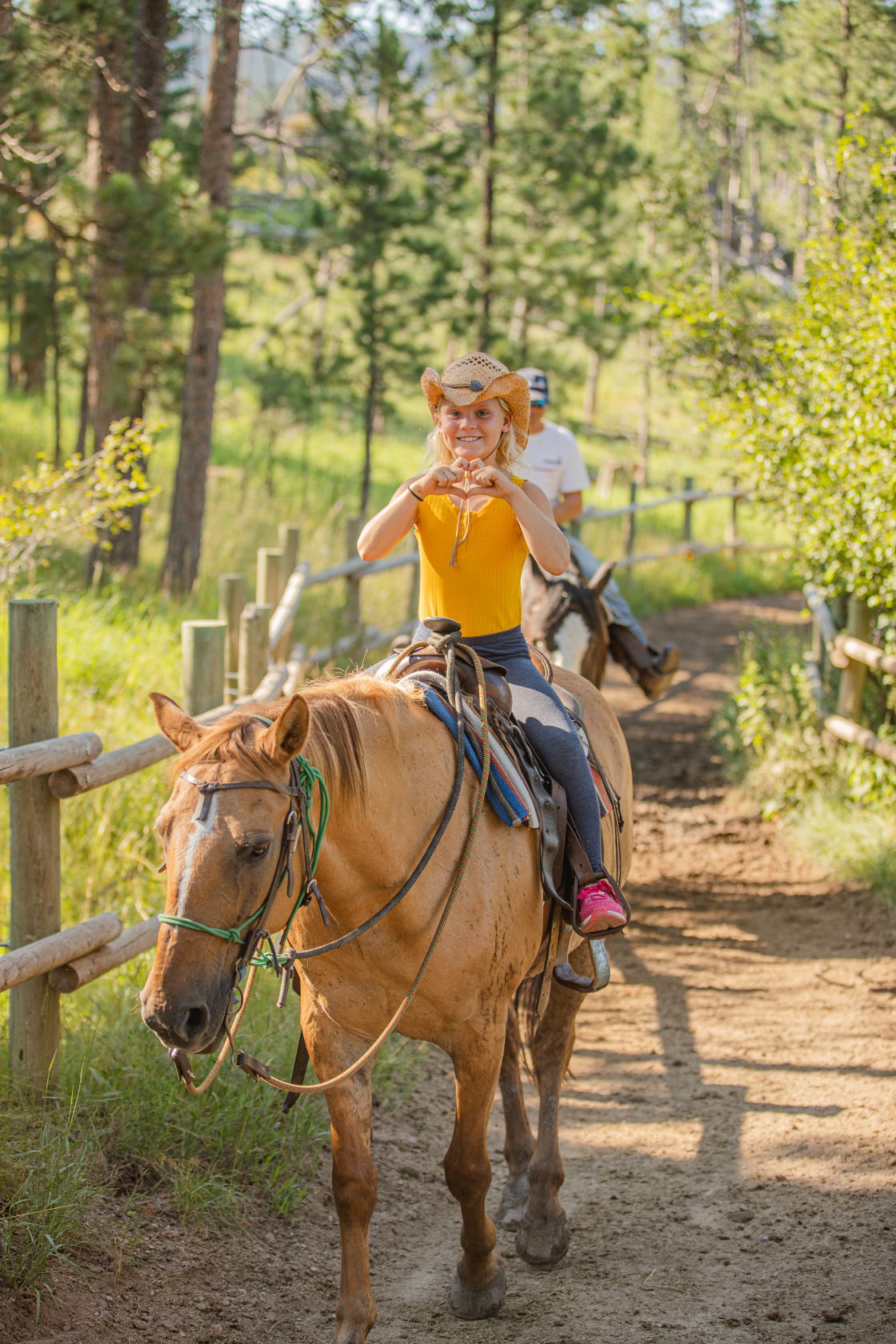 Horseback Riding & Wagon Dinner Show near Mt. Rushmore Heart Happy Ridin'!